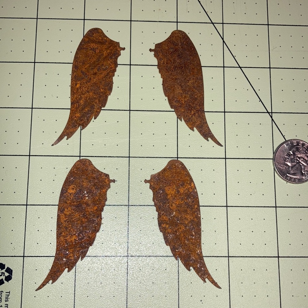 2 pairs of rusted metal angel wings to put on candles